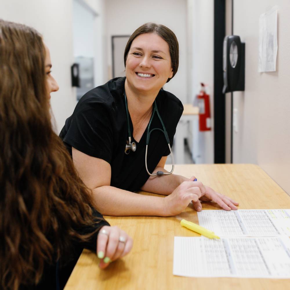 vet sitting and smiling